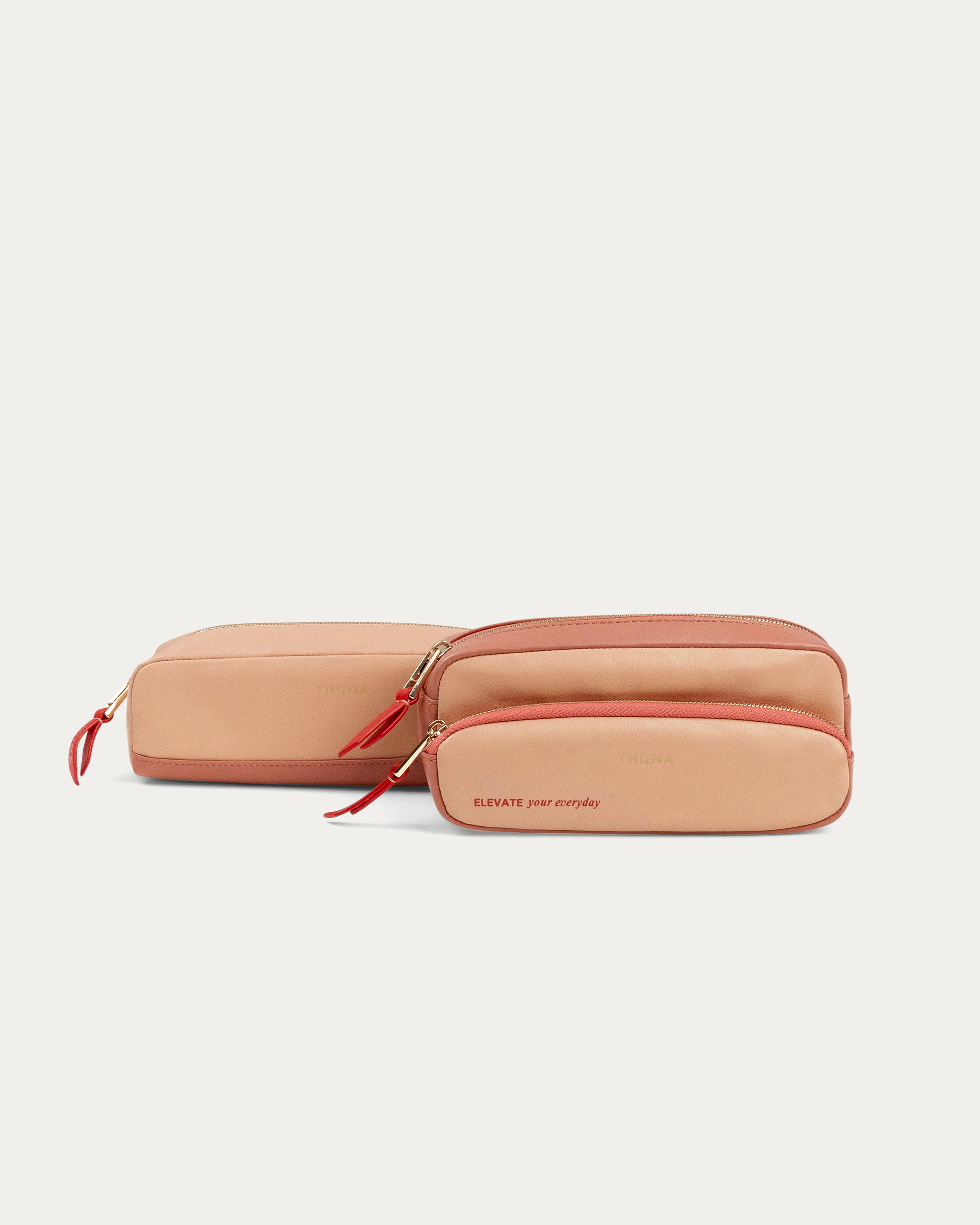Two-tone beige and pink pouch with a red zipper on a white background - Kuwait BAGS - KSA bags 