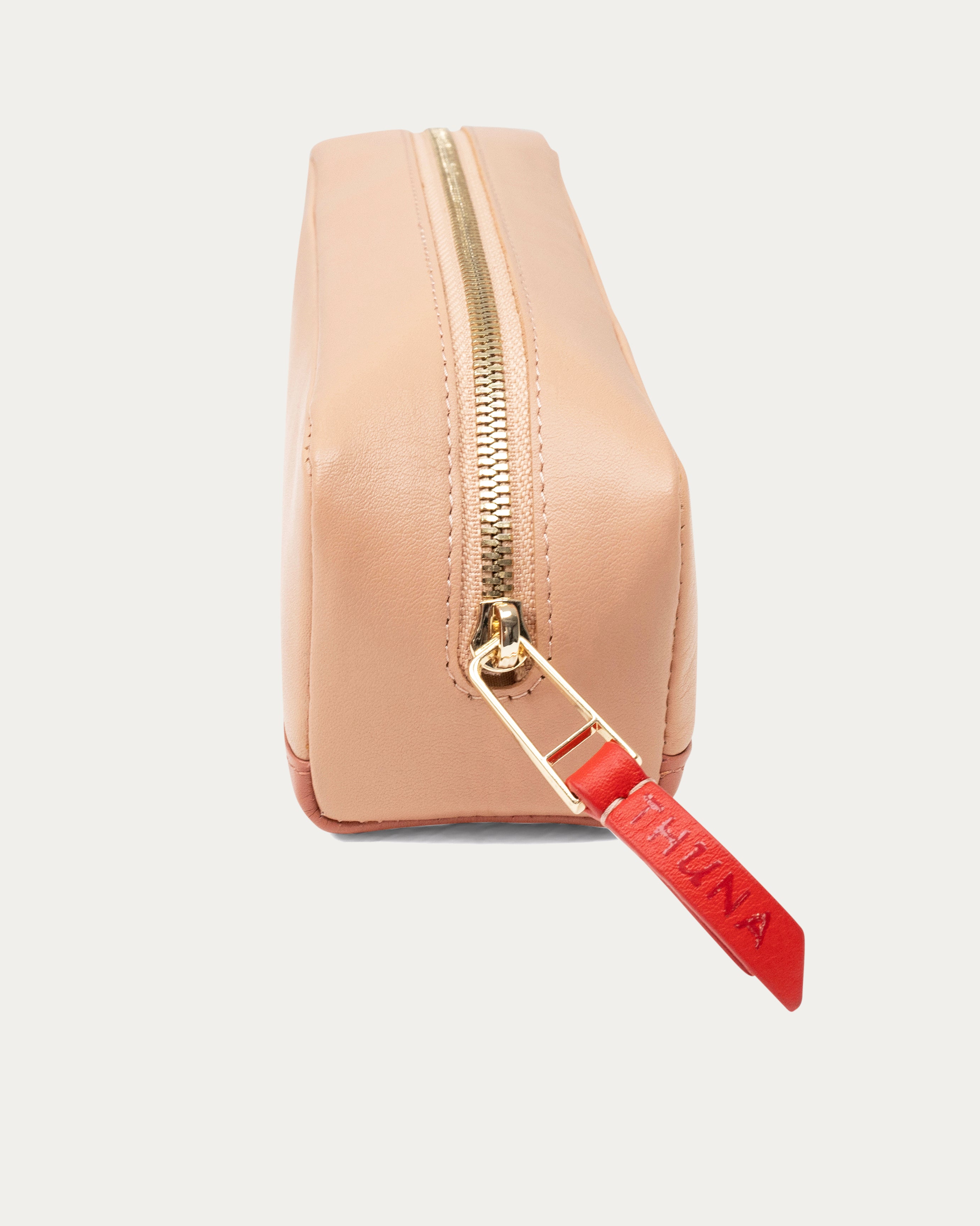 Two-tone beige and pink pouch with a red zipper on a white background - Kuwait BAGS - KSA bags 