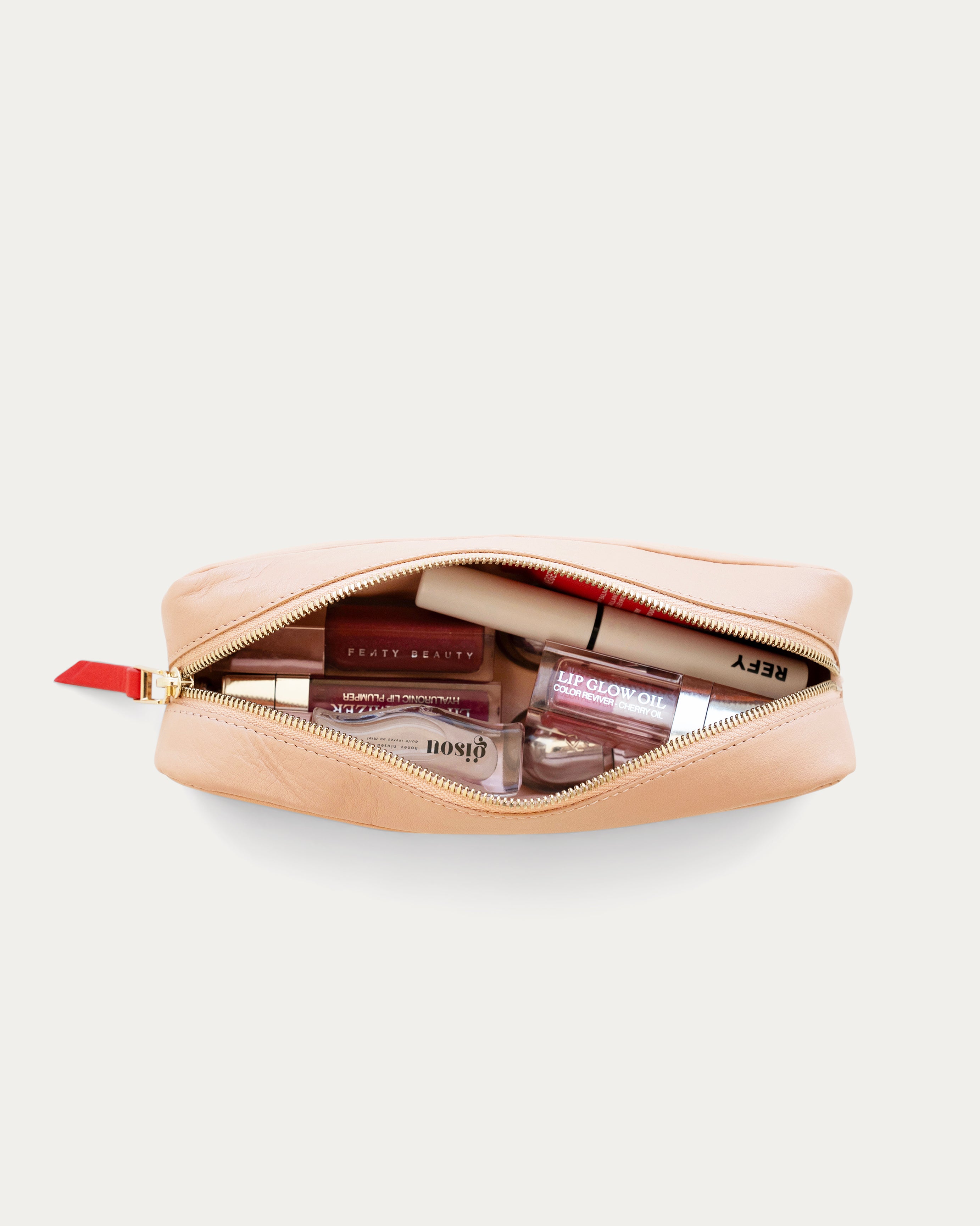 Two-tone beige and pink pouch with a red zipper on a white background - Kuwait BAGS - KSA bags 