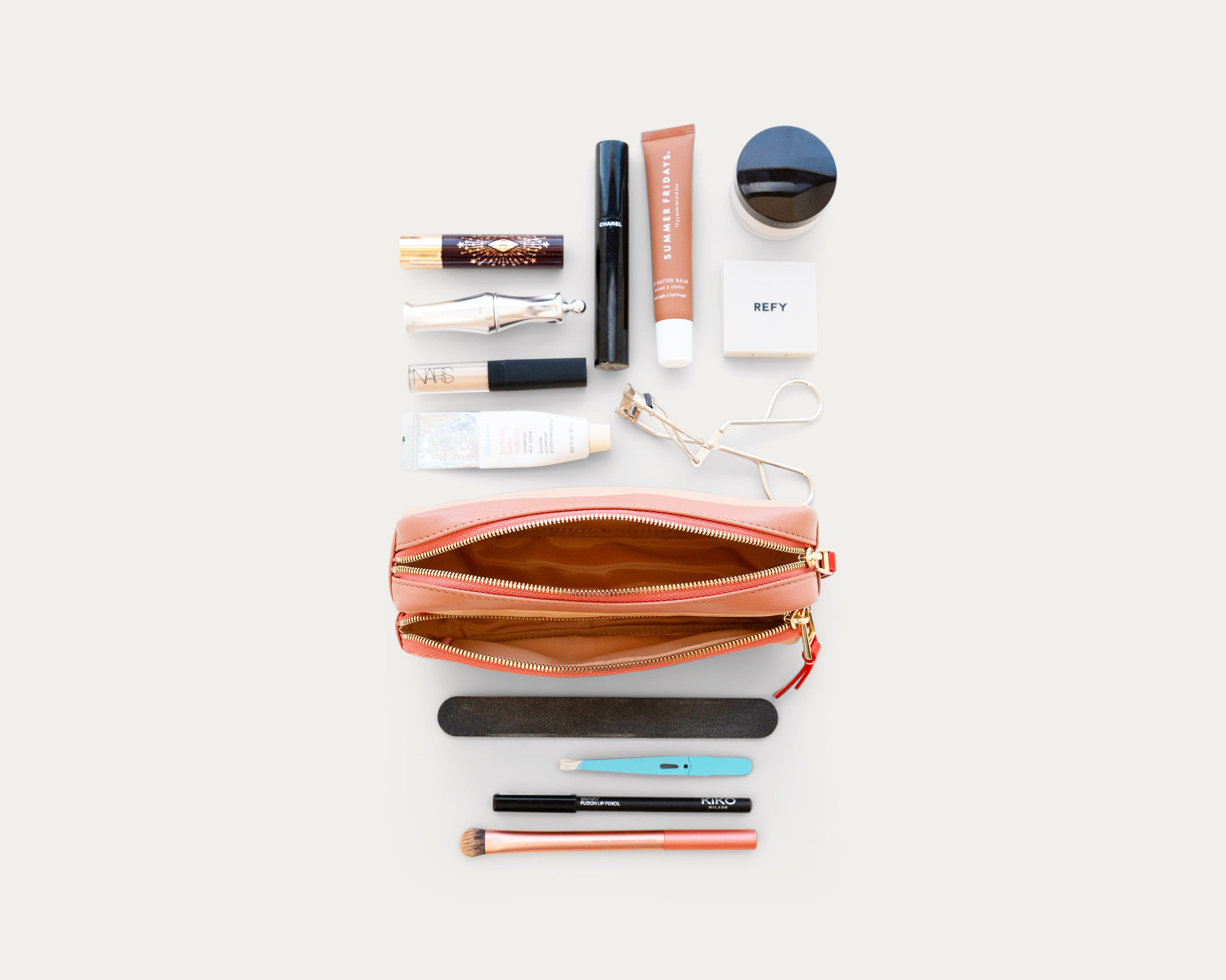 Beige and red rectangular pouch with 'Elevate your everyday' text on a light gray background - Kuwait bags - KSA Bags 