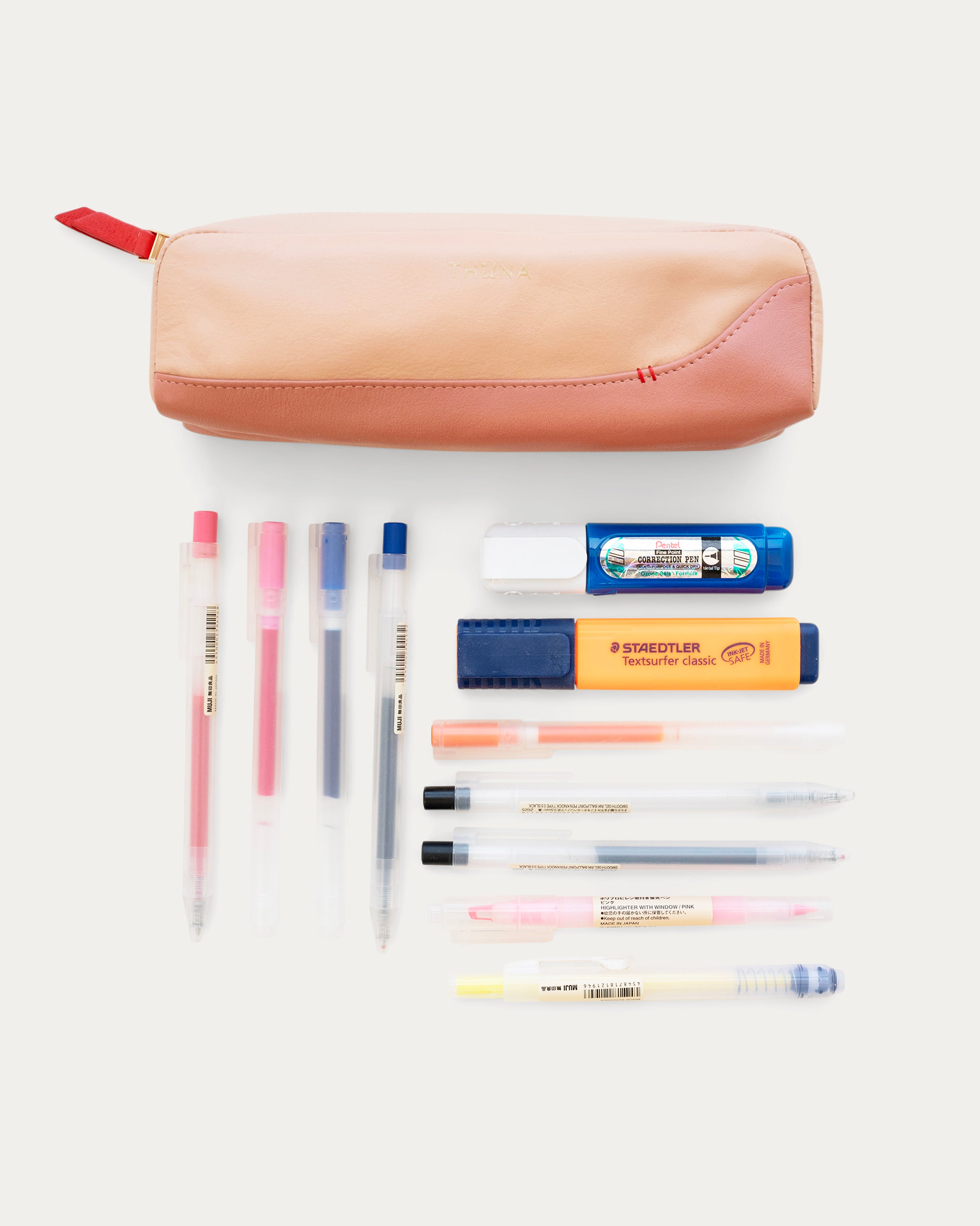 Two-tone beige and pink pouch with a red zipper on a white background - Kuwait BAGS - KSA bags 