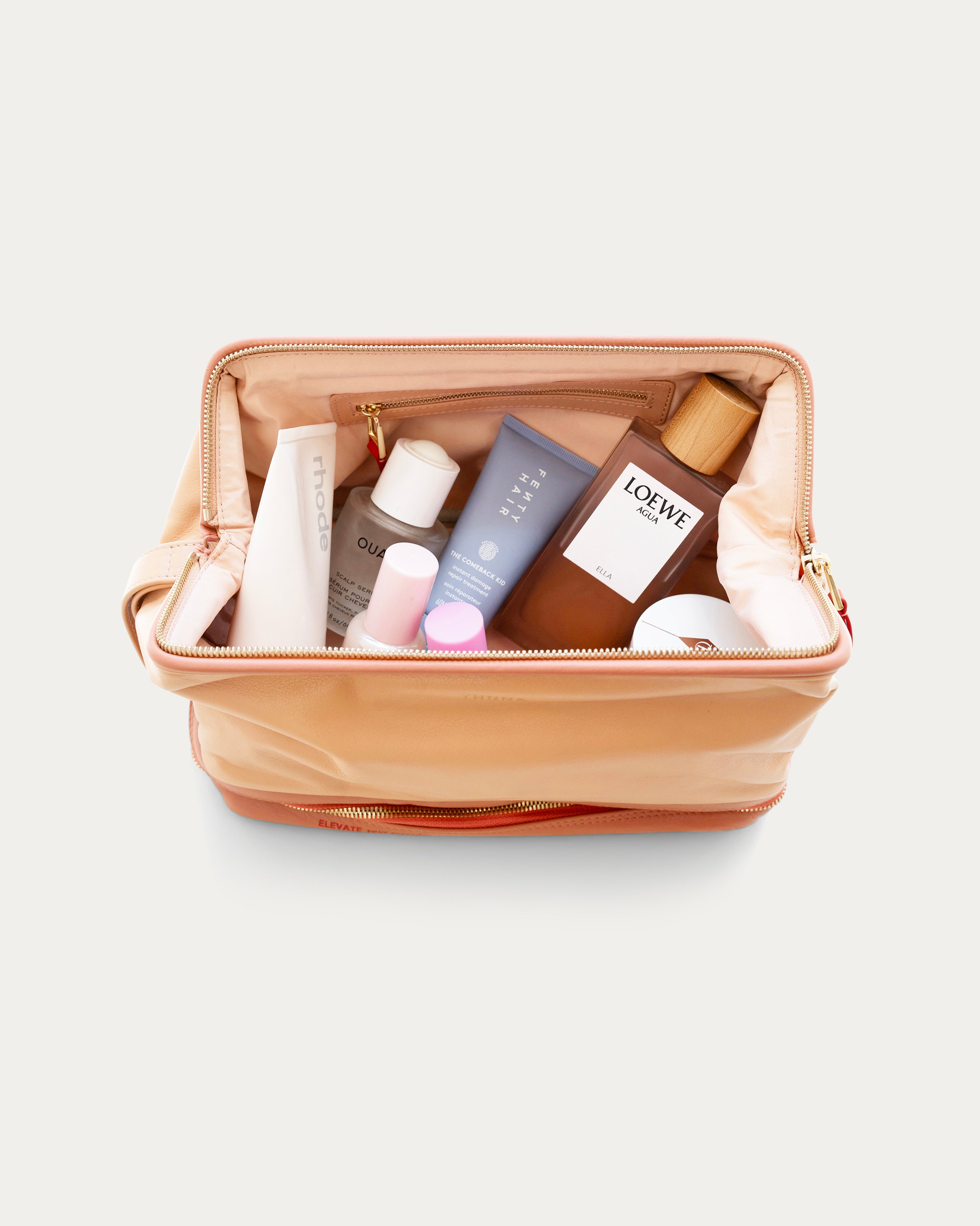 Beige makeup bag with gold zipper on a light gray background - Kuwait bags - KSA