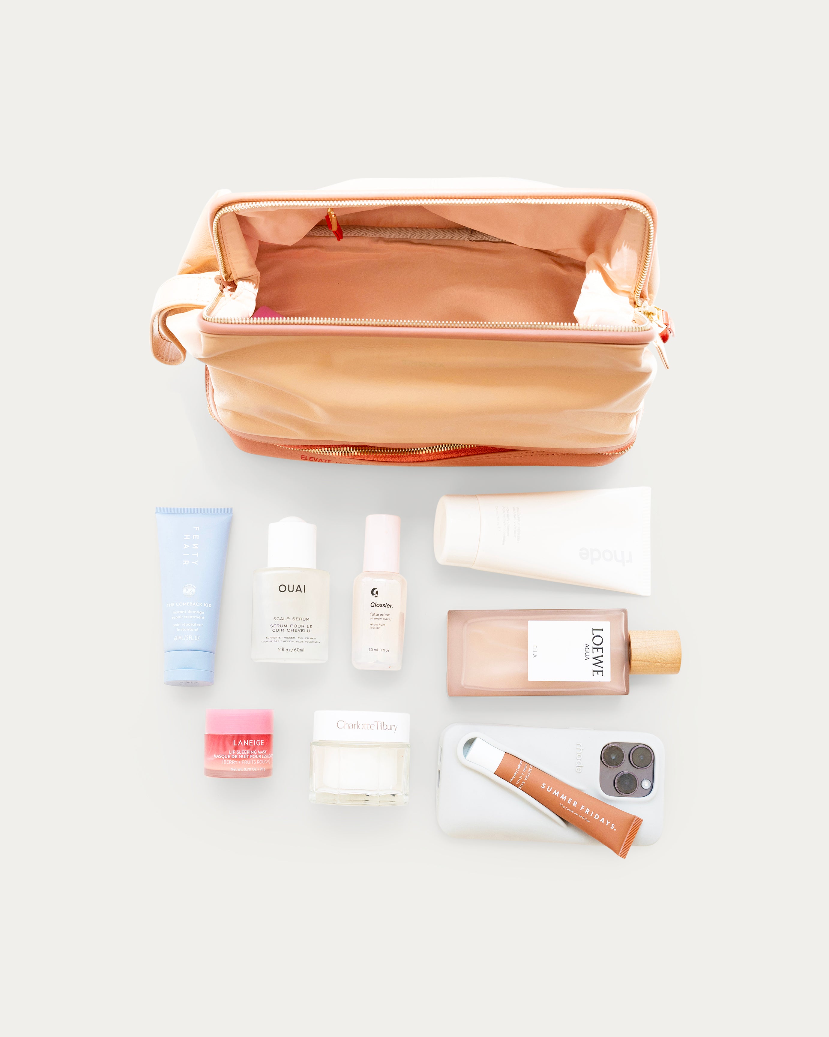 Beige makeup bag with gold zipper on a light gray background - Kuwait bags - KSA