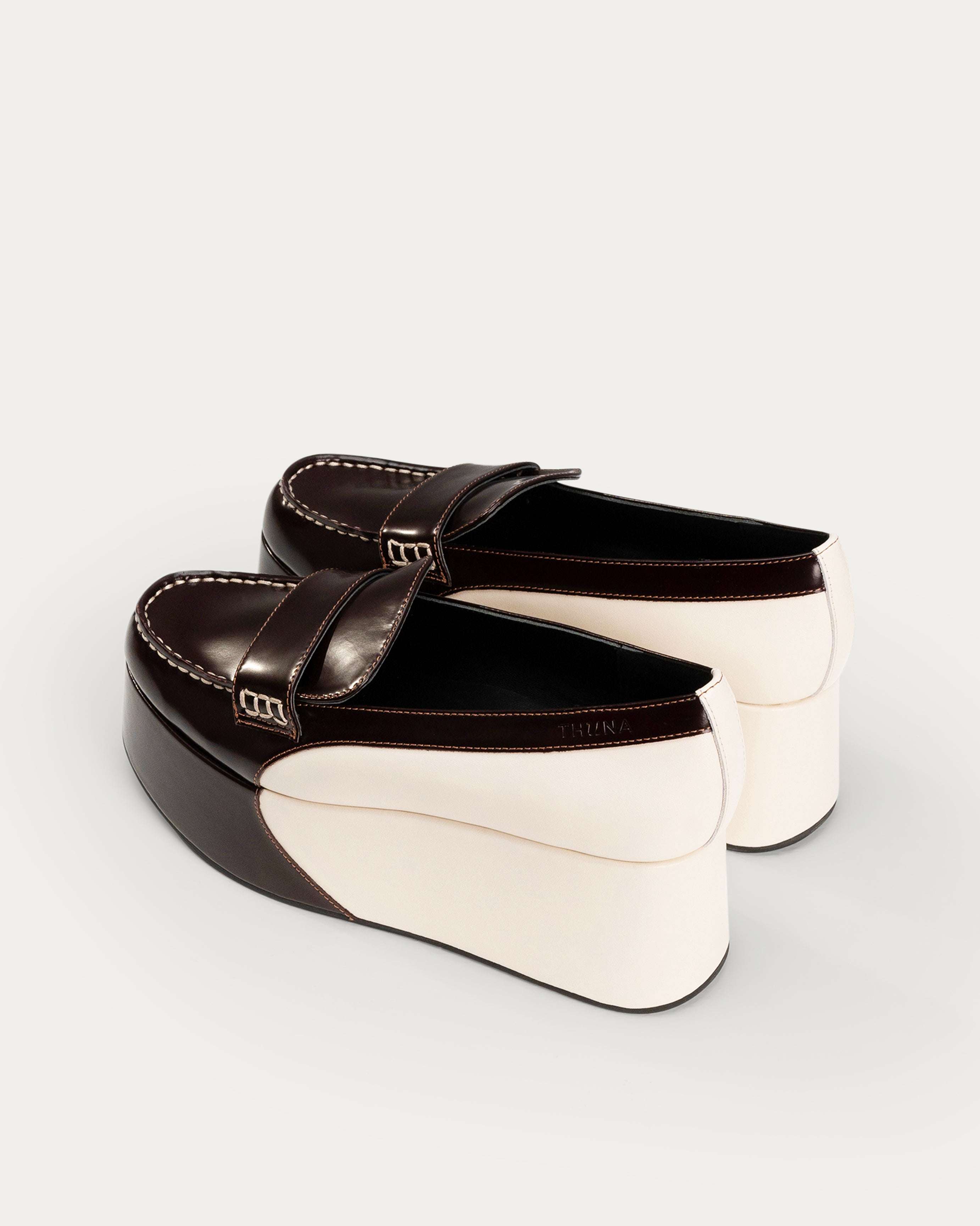 Black and white wedge shoe on a light gray background - Neve brown platform loafer - THUNA Kuwait - KSA 