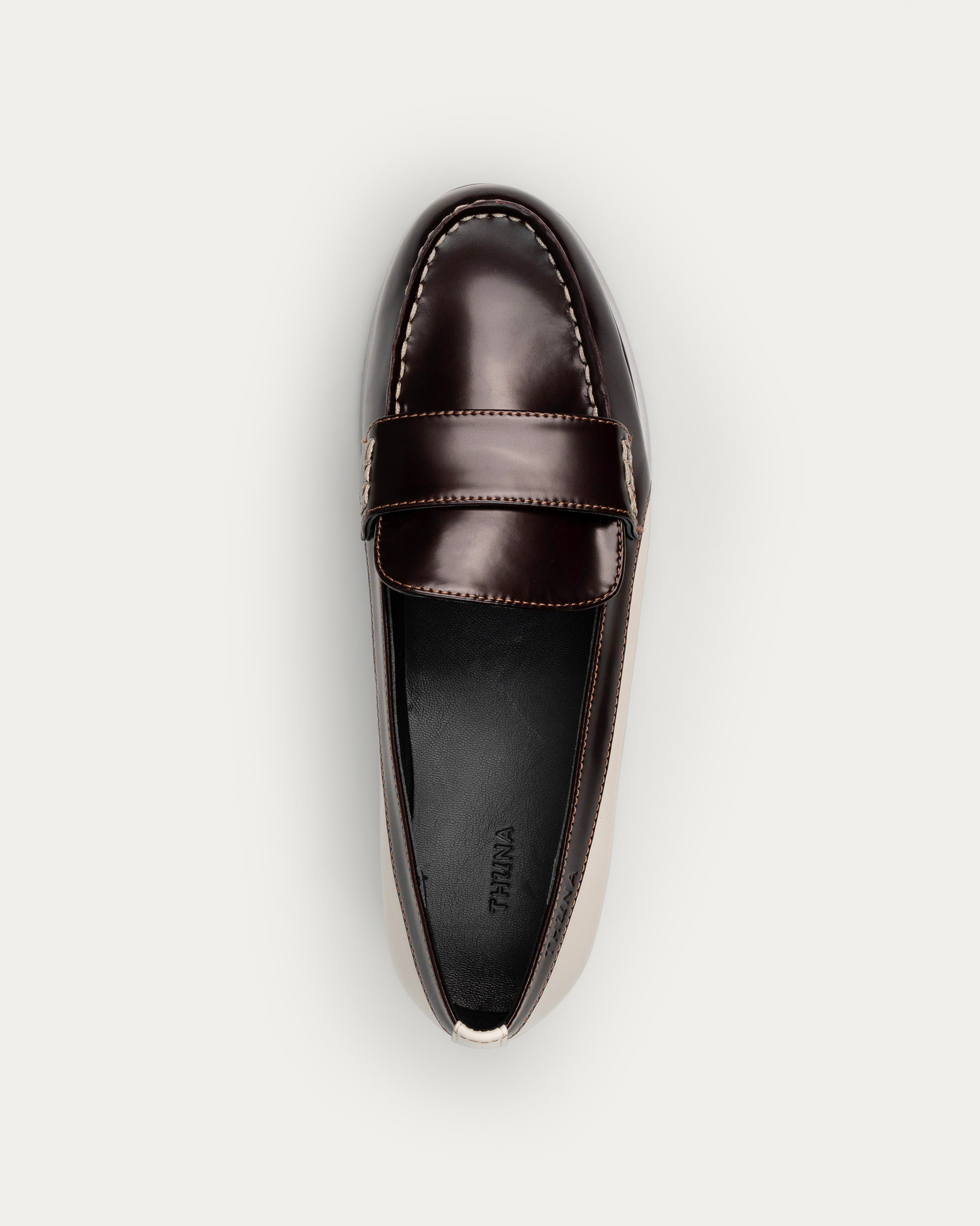 Black and white wedge shoe on a light gray background - Neve brown platform loafer - THUNA Kuwait - KSA 