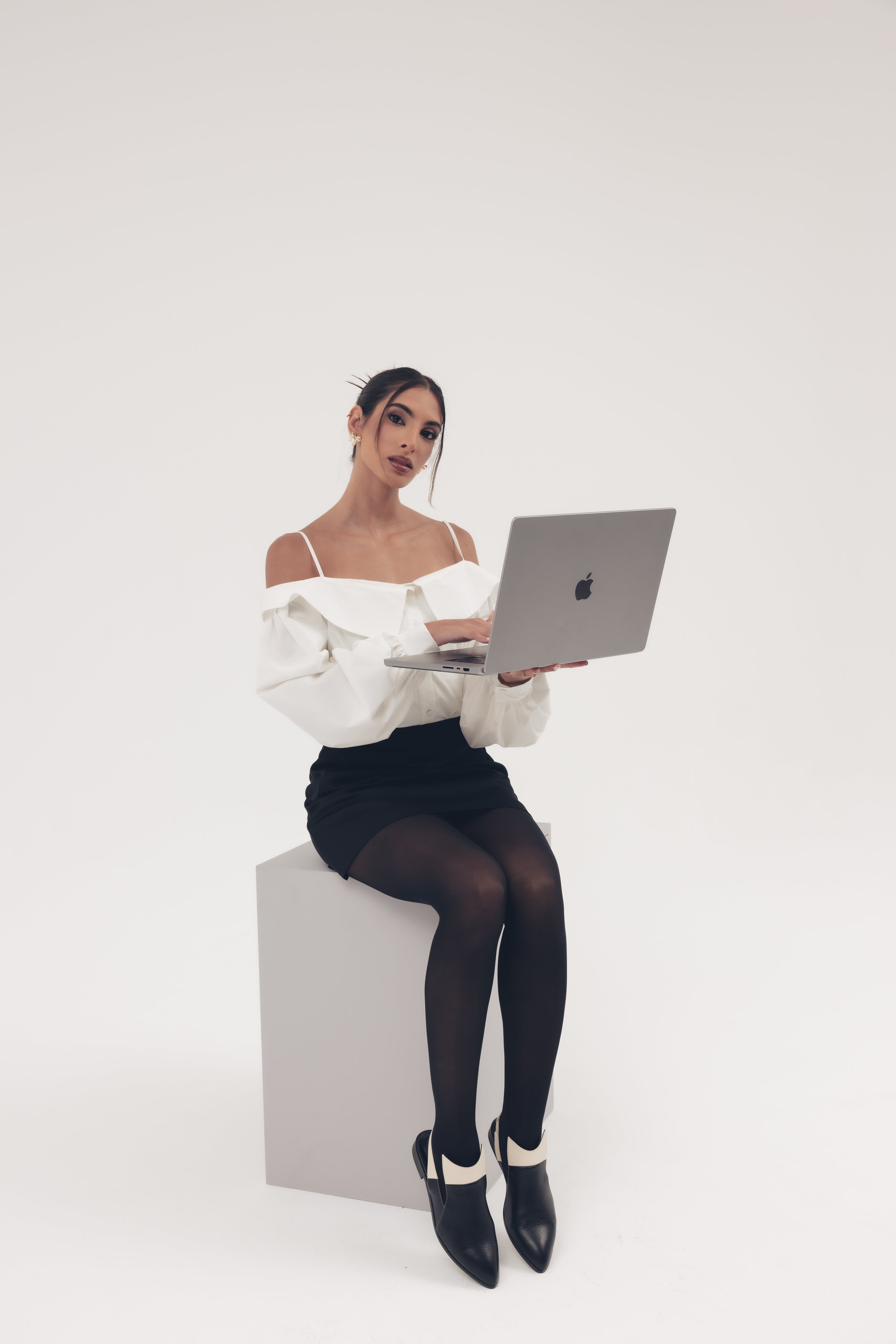 Black slingback shoes with white accents on a light gray background - THUNA Shoes - Kuwait - KSA